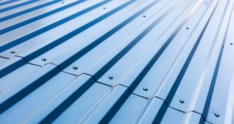 blue corrugated metal roof with rivets, industrial background